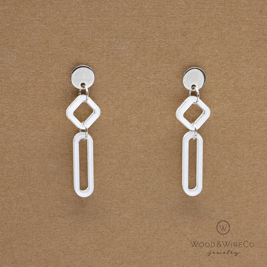 white and silver earrings