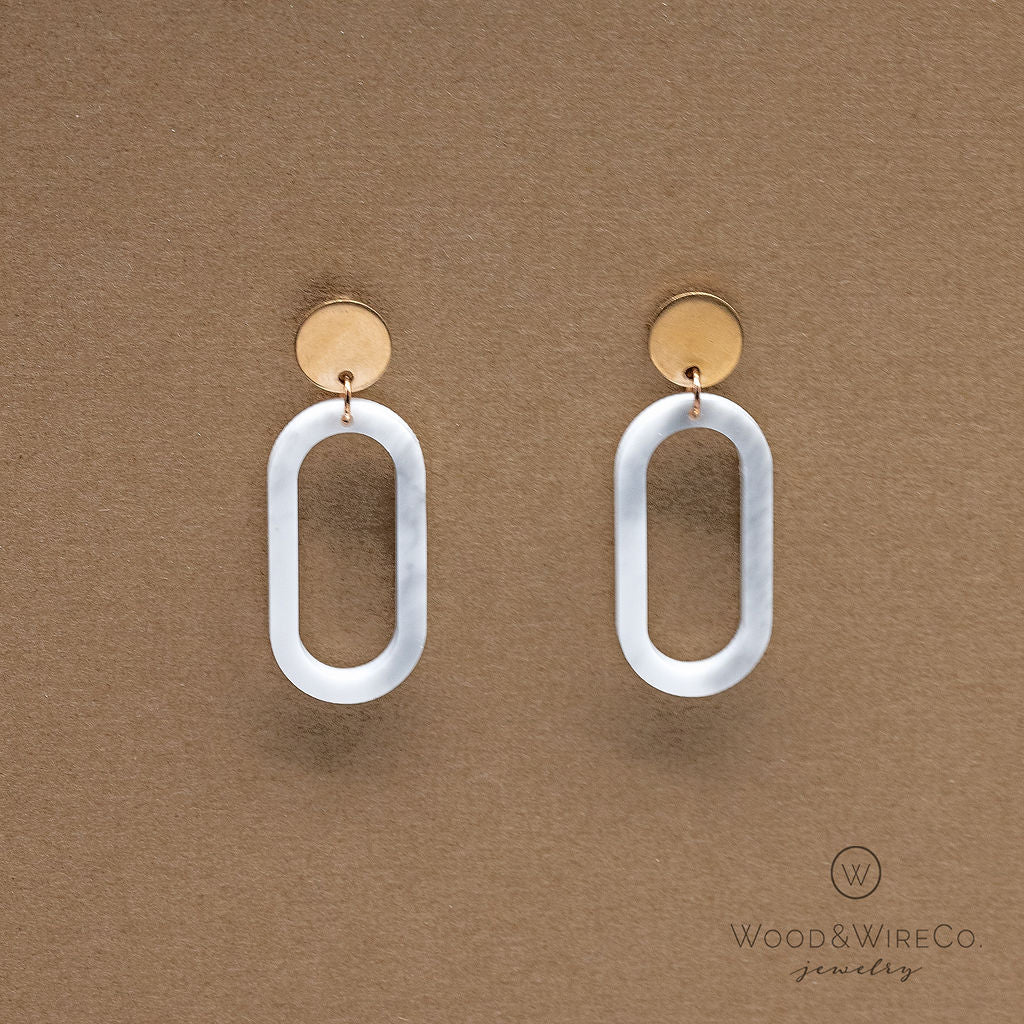 rose gold circle post earrings with white oval dangle hopps