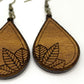 detail photo of leaf engrave on wood teardrop earrings